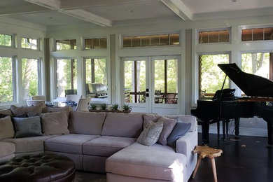 Tuscan dark wood floor and brown floor living room photo in Chicago with a music area and white walls