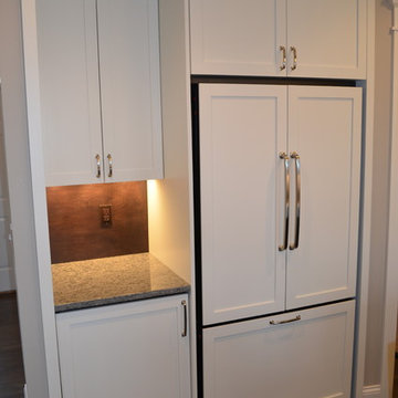 Kitchen With Large Center Island and Separate Cooking Area