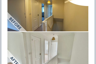 This is an example of a medium sized traditional carpeted straight staircase in Cornwall with wood risers.