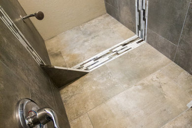Inspiration for a small modern 3/4 gray tile medium tone wood floor alcove shower remodel in Other with a two-piece toilet and white walls