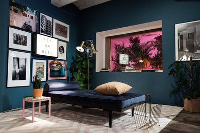 Inspiration for a mid-sized family room in Stockholm with blue walls and dark hardwood floors.