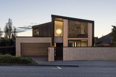 Photo of a mid-sized contemporary two-storey house exterior in Hamilton.