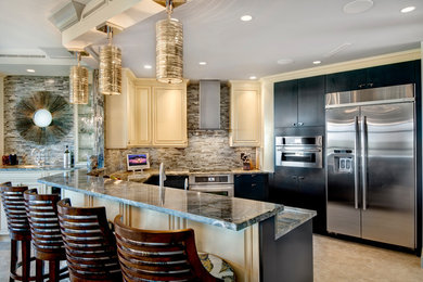 Open concept kitchen - large contemporary u-shaped vinyl floor and beige floor open concept kitchen idea in Miami with an undermount sink, flat-panel cabinets, black cabinets, marble countertops, brown backsplash, matchstick tile backsplash, stainless steel appliances and a peninsula