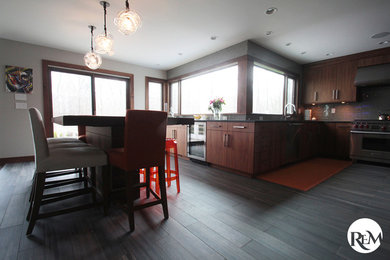 Inspiration for a mid-sized contemporary l-shaped ceramic tile open concept kitchen remodel in New York with a double-bowl sink, flat-panel cabinets, medium tone wood cabinets, marble countertops, gray backsplash, glass tile backsplash, stainless steel appliances and no island