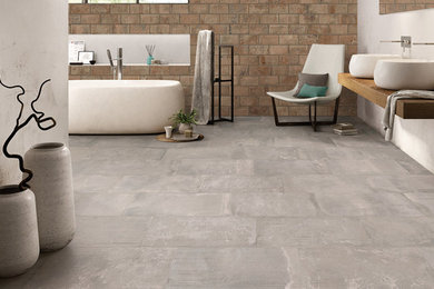 Esempio di una stanza da bagno con piastrelle marroni, piastrelle in ceramica, pavimento con piastrelle in ceramica e pavimento grigio