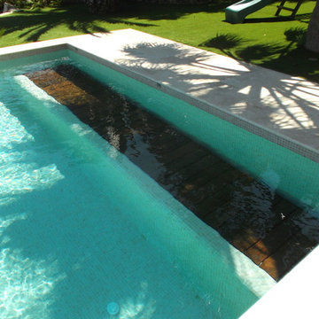 Couverture de piscine immergée sur débordement - Caisson en banc