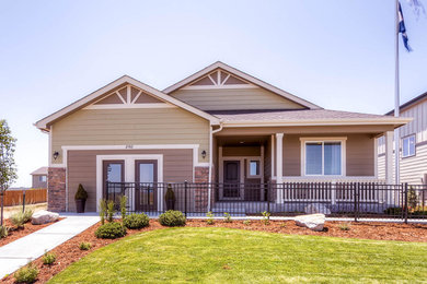 Inspiration for a craftsman beige one-story exterior home remodel in Denver
