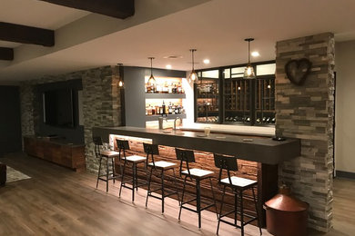 Mid-sized trendy vinyl floor and beige floor home bar photo in Other with concrete countertops