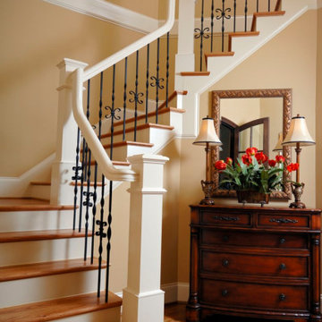Classic Style Staircase with Painted Wood, Stained Wood and Iron Parts