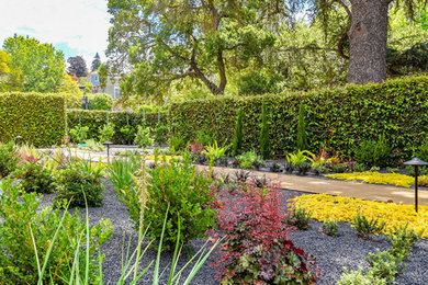 Photo of a mediterranean side yard decomposed granite landscaping in San Francisco.