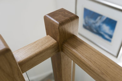 Inspiration for a contemporary carpeted u-shaped glass railing staircase in Dorset with carpeted risers.