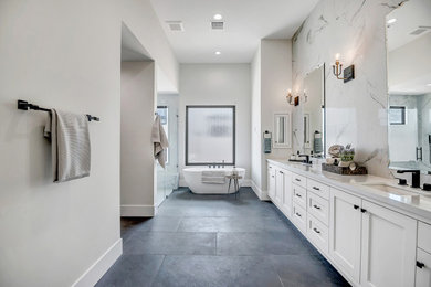 Bathroom - transitional black and white tile and porcelain tile porcelain tile and black floor bathroom idea in Phoenix with shaker cabinets, white walls, an undermount sink, quartz countertops, a hinged shower door, white countertops and a built-in vanity