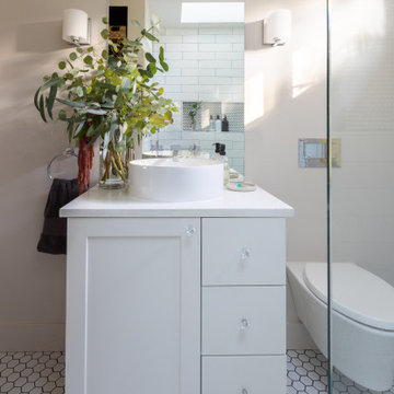 Light-Filled, Space-Defying Bathroom with Wall-Mounted Fixtures