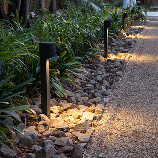 Inspiration for a large sloped partial sun garden for summer in Santa Barbara with a garden path and gravel.