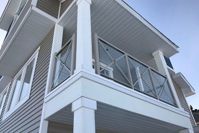 Inspiration for a contemporary glass railing balcony remodel in Calgary