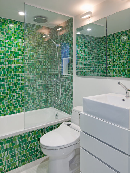 Mosaic Bathroom Tile Ideas Inspiration for an eclectic bathroom remodel in New York with mosaic tile, a vessel sink