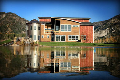 Large urban multicolored two-story metal house exterior photo in Other with a shed roof and a metal roof