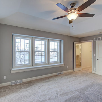 Bedroom with Tray Ceiling and Window Seat