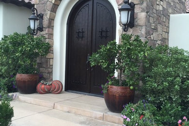 Mediterranean brown stone house exterior idea in Other