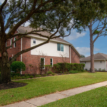 Re-side and gutters of mid-90's 2 story house in Houston, TX