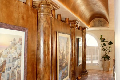 Inspiration for a mid-sized mediterranean hallway remodel in Houston with beige walls