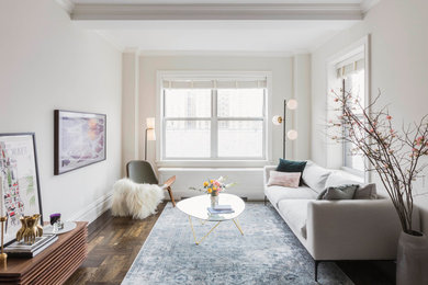 Inspiration for a mid-sized eclectic dark wood floor living room remodel in New York with white walls and no fireplace