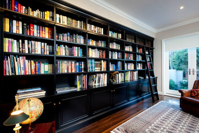 Inspiration for an expansive traditional home office in Perth with no fireplace, a library and dark hardwood floors.