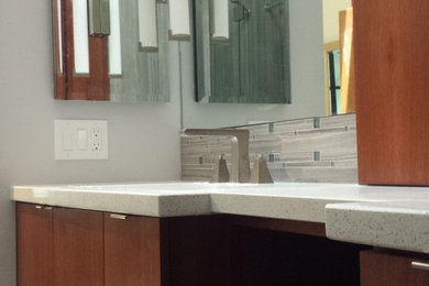 Inspiration for a modern master gray tile and porcelain tile bathroom remodel in Los Angeles with medium tone wood cabinets and quartzite countertops