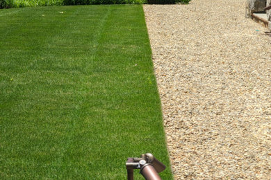 Inspiration for a large rustic full sun front yard gravel landscaping in Atlanta.