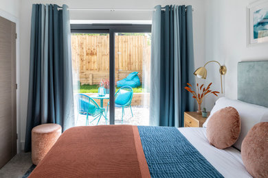This is an example of a mid-sized contemporary bedroom in Devon.