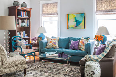 Living room - mid-sized traditional enclosed medium tone wood floor living room idea in DC Metro with gray walls