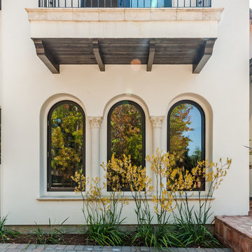 Mediterranean Windows with Corbeled Arches