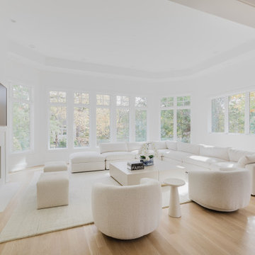 Glencoe All-White Living Room With Curved Seating and Soothing Natural Light