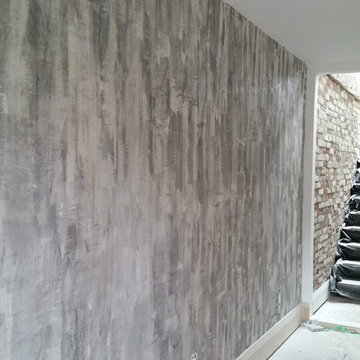 Custom metallic shimmer plaster feature wall.