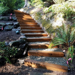 Photo of a modern backyard xeriscape in Seattle with with path and gravel.