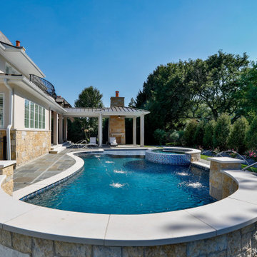 Naperville, IL freeform swimming pool with hot tub, large sunshelf, glass tile