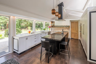 Example of a mid-century modern kitchen design in Vancouver