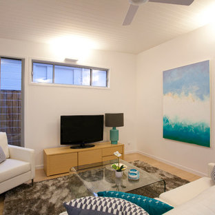 Example of a coastal home theater design in Sunshine Coast