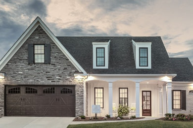 Inspiration for a mid-sized timeless gray one-story mixed siding exterior home remodel in Other with a shingle roof