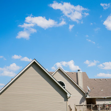 Seamless Polymer Siding in Mountain Clay w/ Energy Efficient Replacement Windows