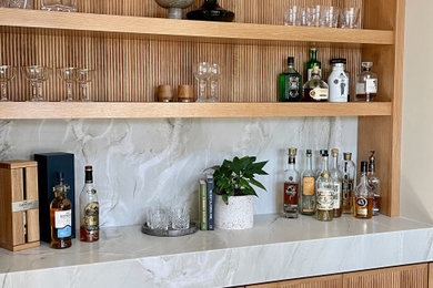 Inspiration for a transitional home bar remodel in San Diego