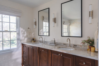 Inspiration for a mid-sized modern master beige tile and marble tile marble floor and double-sink bathroom remodel in DC Metro with furniture-like cabinets, medium tone wood cabinets, a two-piece toilet, beige walls, an undermount sink, quartzite countertops, a hinged shower door, beige countertops and a built-in vanity