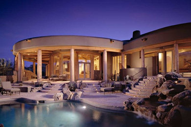 Inspiration for a large backyard stone natural pool remodel in Phoenix