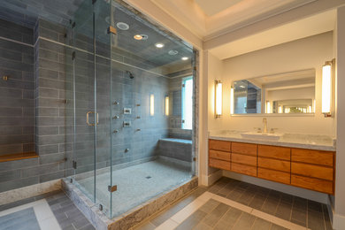 Transitional bathroom photo in Austin with an undermount tub and a vessel sink