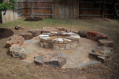 This is an example of a southwestern landscaping in Austin with a fire pit.