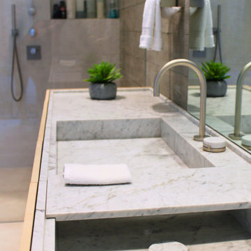 Board-Formed Concrete Wall with Open Shower and Marble Vanity