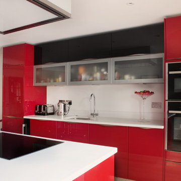 High gloss red kitchen with built in appliances
