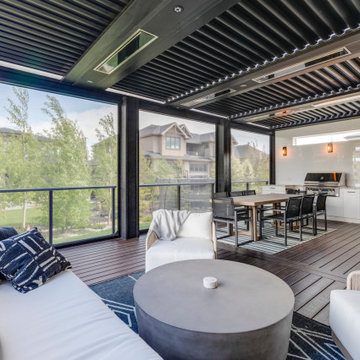 Adjustable StruXure Pergola Featuring Outdoor Kitchen With Screens & Heaters