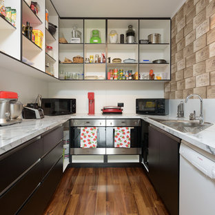 Modern kitchen pantry pictures - Example of a minimalist u-shaped medium tone wood floor kitchen pantry design in Hamilton with a single-bowl sink, open cabinets and stainless steel appliances