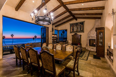 Tuscan great room photo in Los Angeles with beige walls, a corner fireplace and a stone fireplace